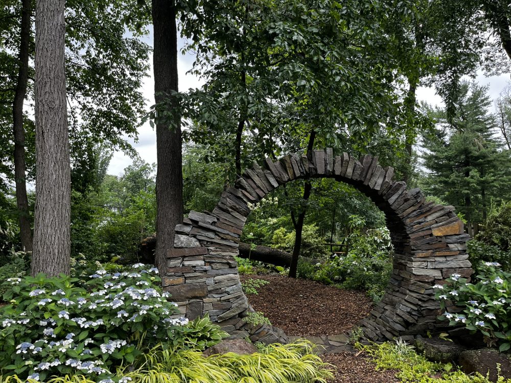 Lasting Landscapes by Carol moon gate with fallen log in background